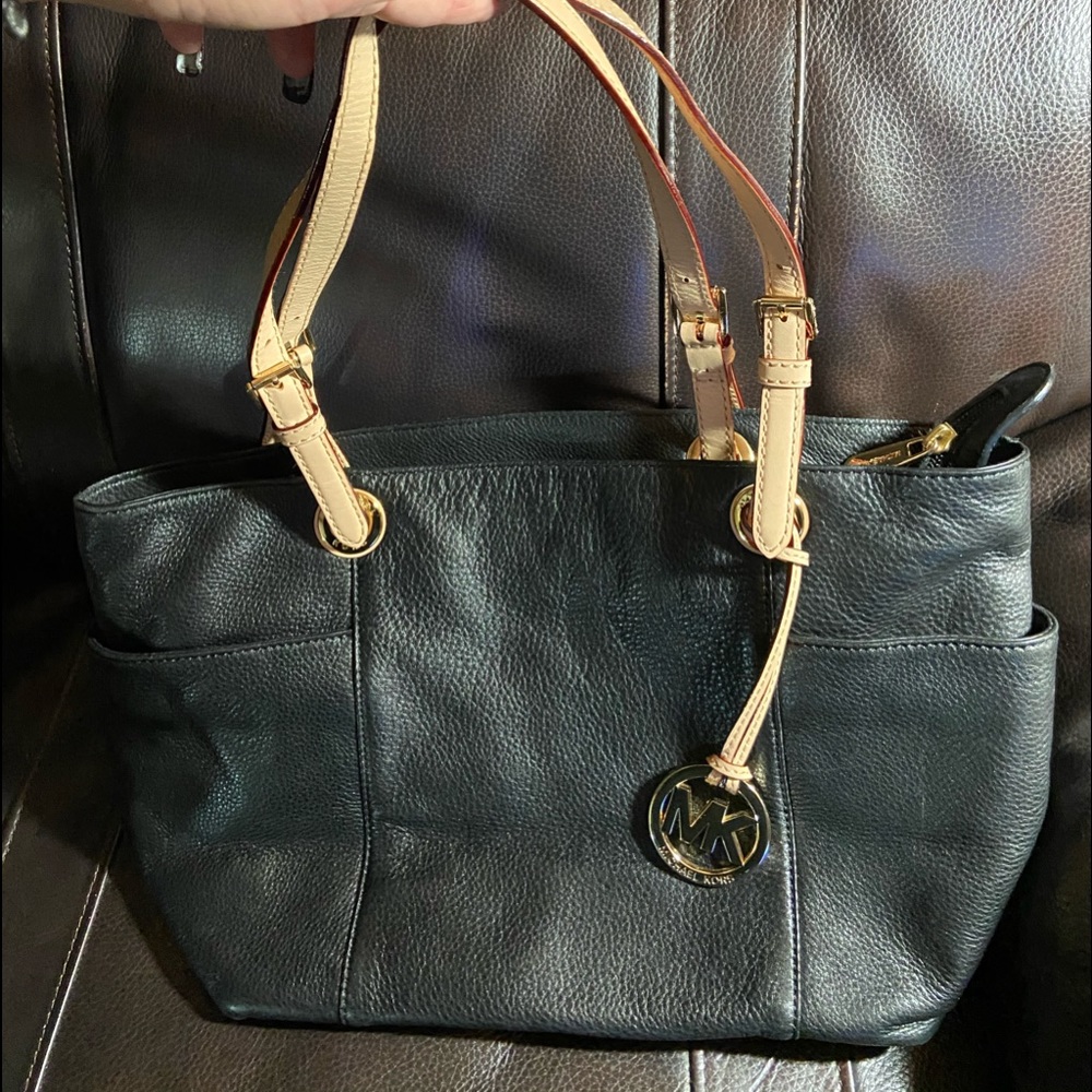 Michael Kors black tote with gold lining.